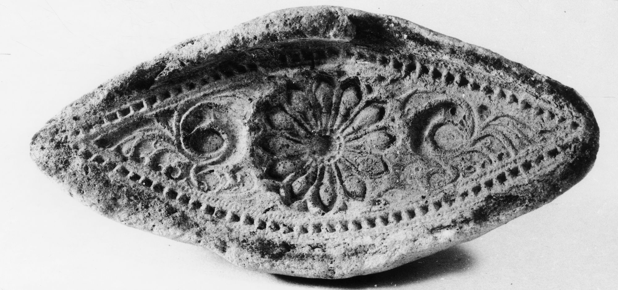 Front. Leaf-Shaped Mold, Paithan, Maharashtra, India, ca. 1st-3rd century CE, Terracotta, H. 8.6 x L. 4.2 cm. #100027.
