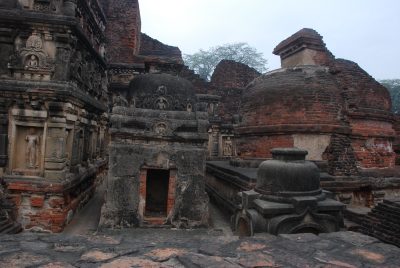 Brick stupas in front of the great Monument of Site 3, Nalanda Mahavihara.